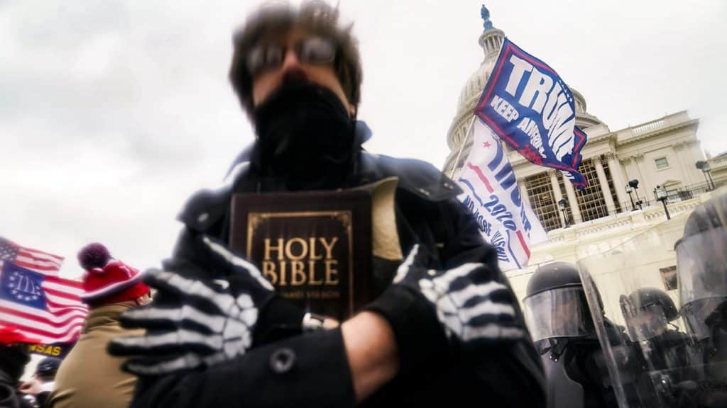 pastor charged capitol riot nationalism political bad faith