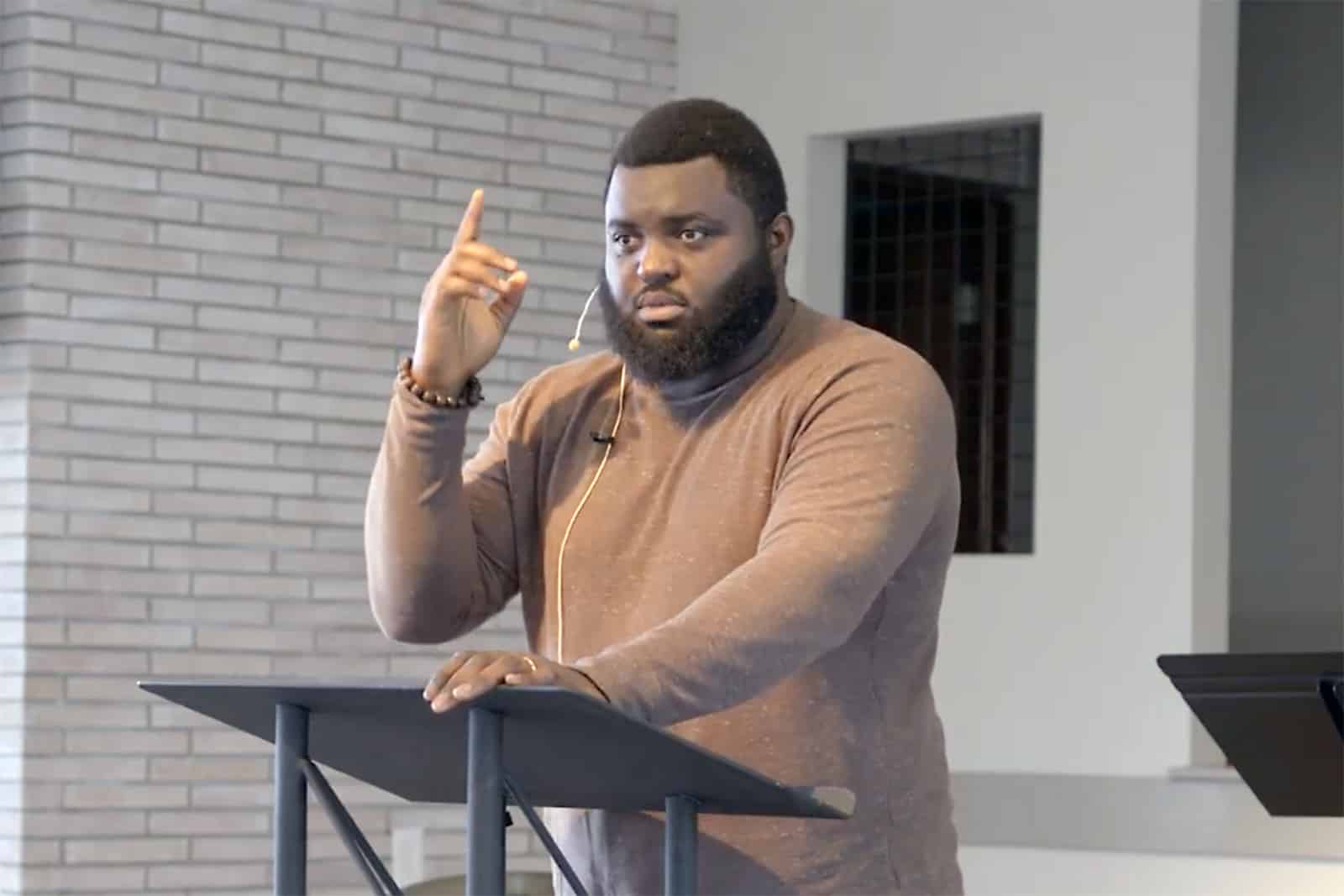 Samuel Sey preaches on immigration in April 2026. “Don’t call ICE,” he joked. “I’m a legal immigrant, don’t worry.” (Video screengrab)